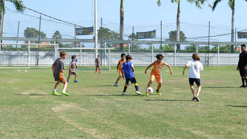 Sports at CCS, Bali - Students playing Soccer outside