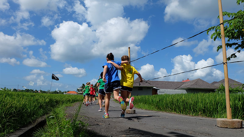 Sports at CCS Bali - Students running through campus