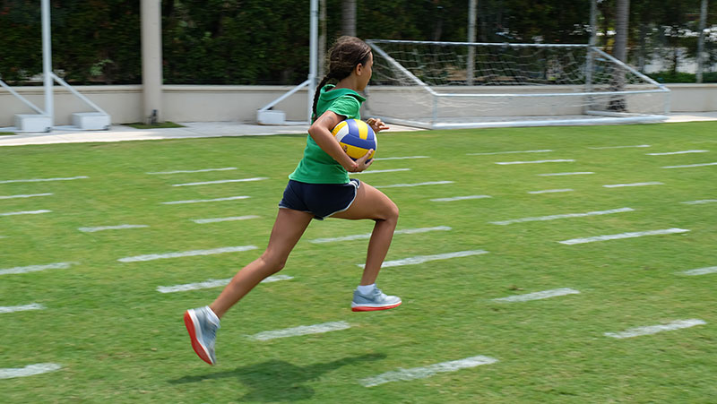 Sports at CCS, Bali - Student running during Athletics lesson